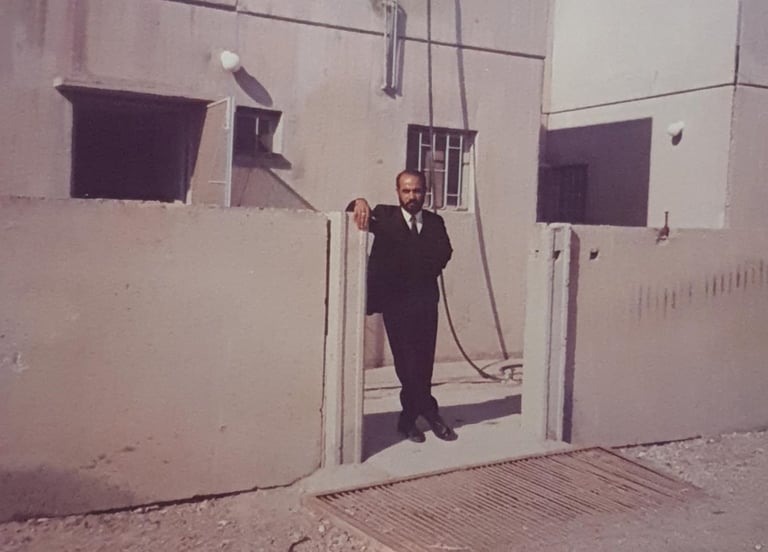 Ravinder Vashisht in front of completed house
