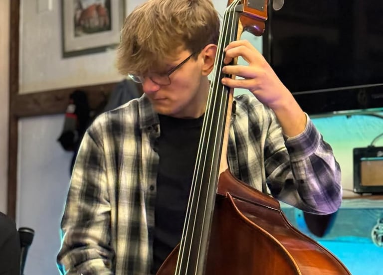 An image of Jamie Walker performing Jazz on his Double Bass