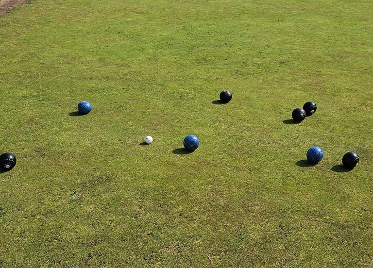Lawn bowls being played on Porthcawl bowls club green