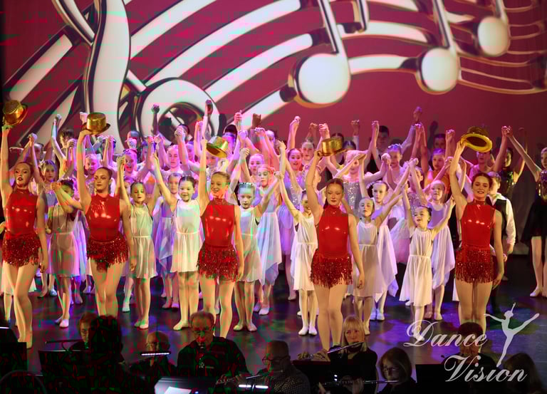 a group of young children and adults performing a musical performance