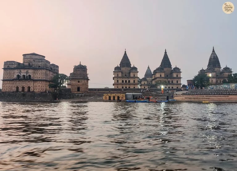 Scenic view of Orchha's royal cenotaphs from a boat on the Betwa River.