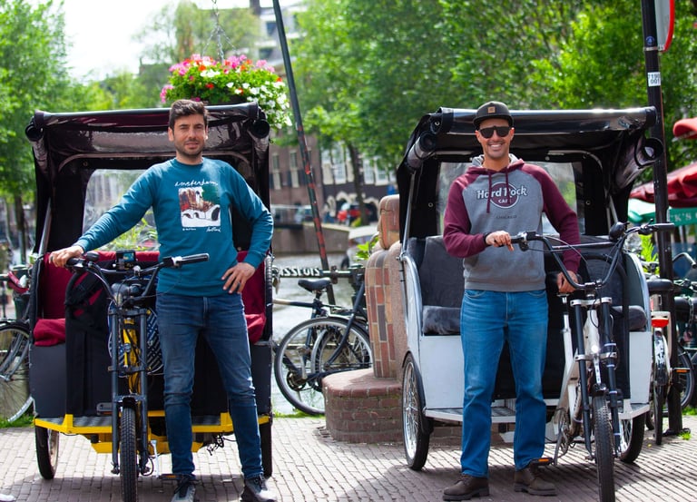 italian guys next to their bike taxis