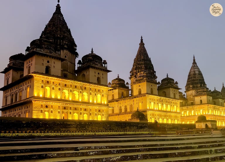 Orchha's illuminated cenotaphs under the night skies.