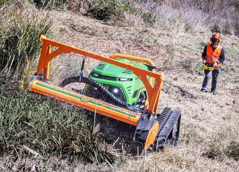 Green Climber LV 600 Pro Model mowing vegetation with operator in PPE safe distance away