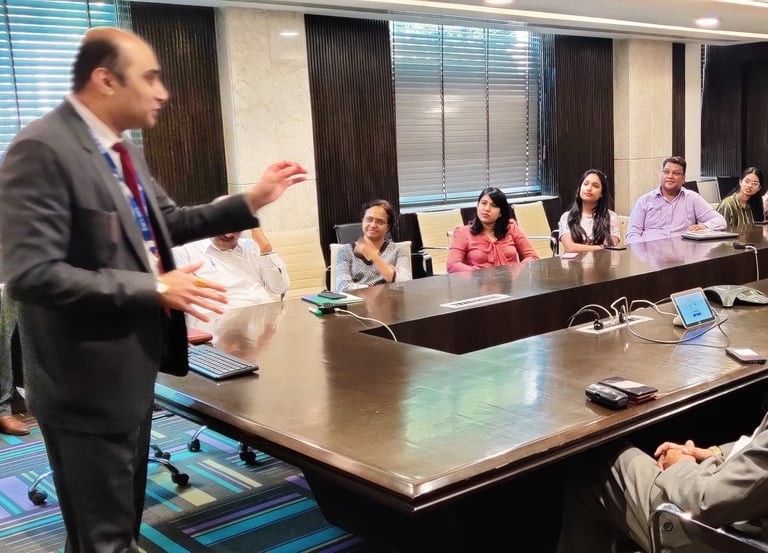 Dr. Prabal Frank Nandwani conducting corporate leadership training workshop in a large boardroom
