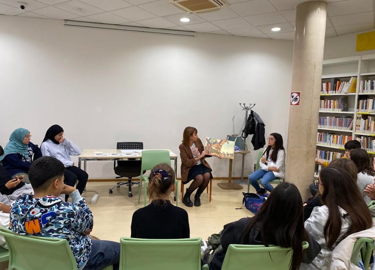 a group of people sitting in chairs in a room