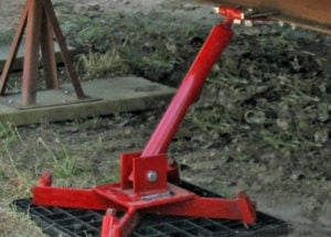 Close-up of Anchor Brace system securing a HUD-code home to ground anchors — approved for California