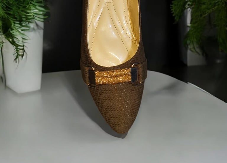 a pair of shoes with a brown shoelaced shoe