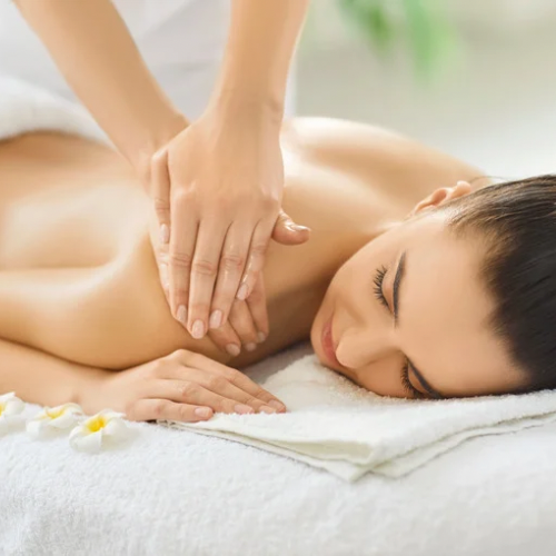 A relaxed woman receiving a professional back massage at Spirit Zen Soul Therapy