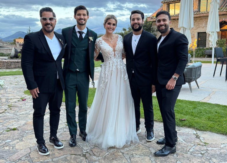 a bride and groomsmen posing for a photo