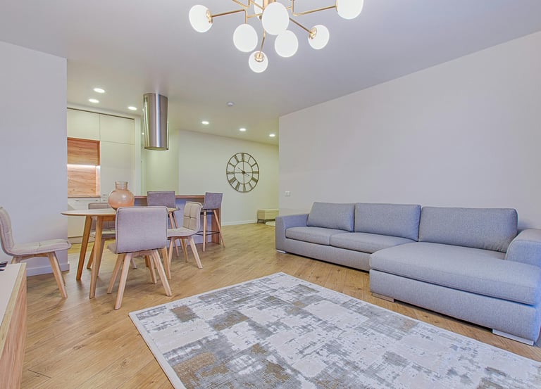 a living room with a couch and a clock