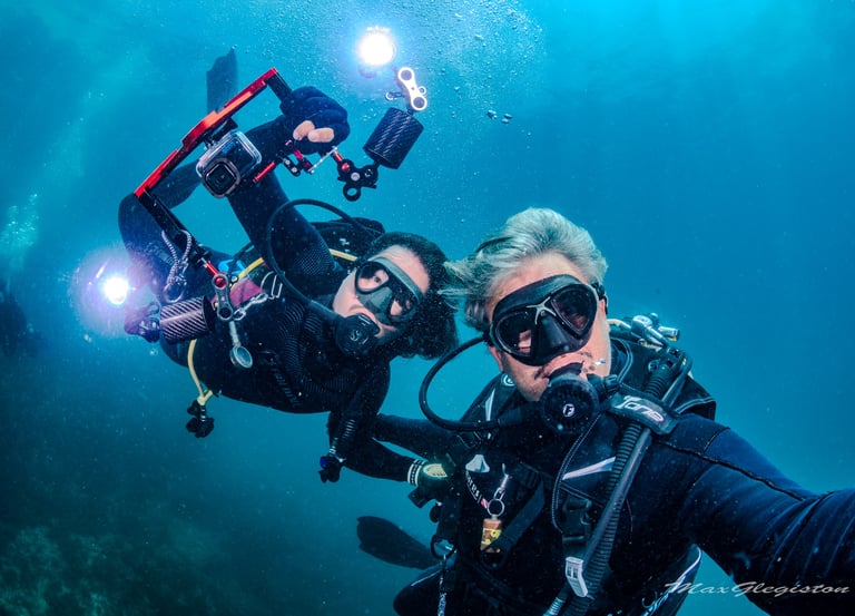 two people are scubaking in the water