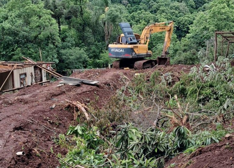 a construction worker is working on a hill top