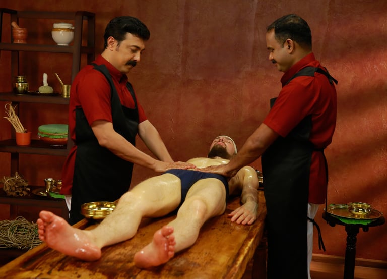 Qualified Ayurvedic practitioners performing abhyangam