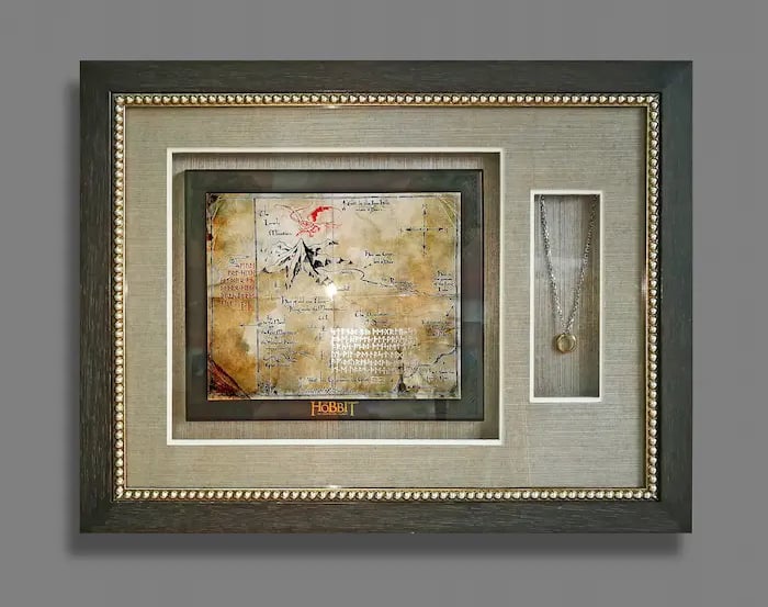 A shadow box frame encasing LoTR limited edition collectables