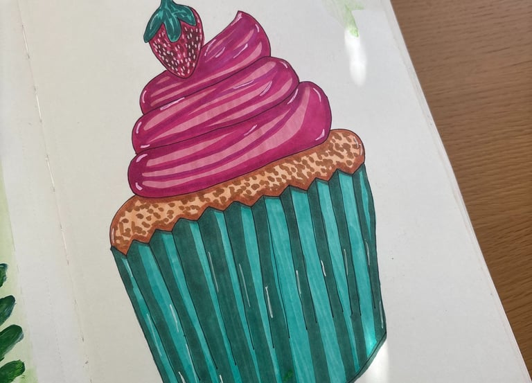 a book opened to show a cupcake
