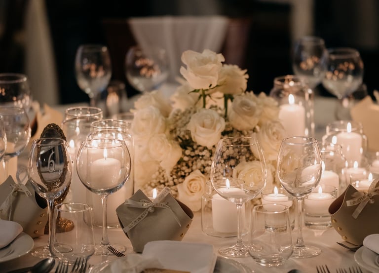 a table setting with candles and candles
