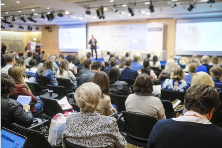 a man standing in front of a crowd of people