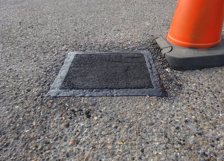 Pothole repair with sealed edges