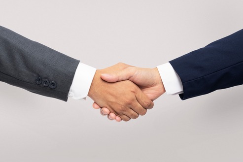Saudi Food Registration Handshake or meeting between two business professionals
