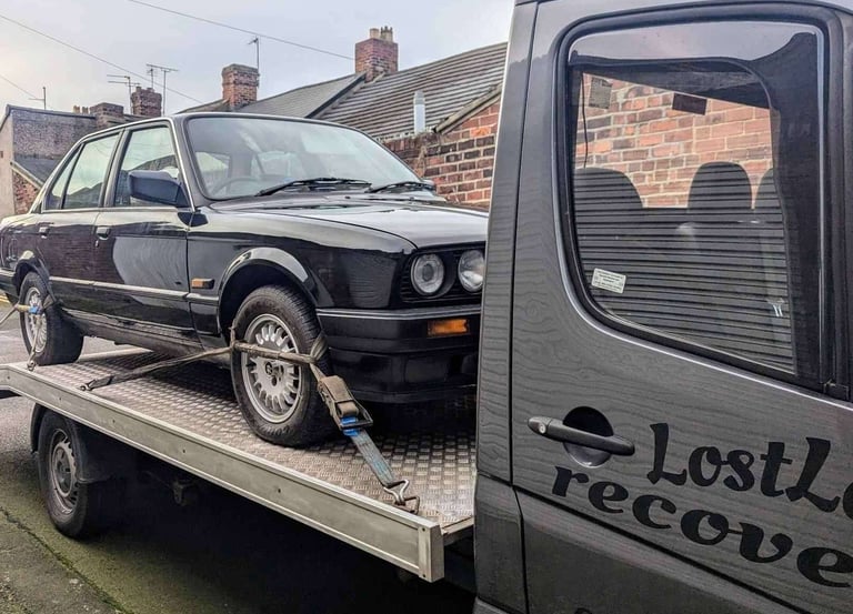 a car being towed by a tow truck