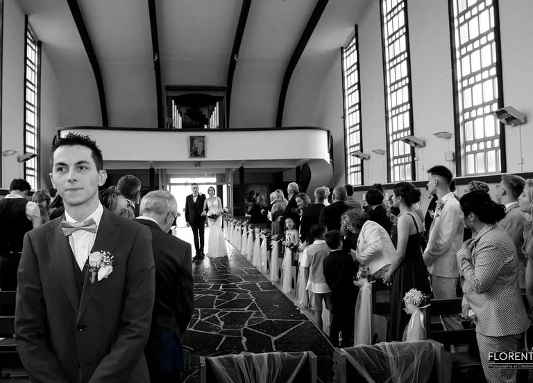  photographe mariage florent lille saint omer touquet man in a suit and bow tie standing in a church