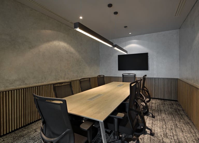 a conference room with a long table and chairs
