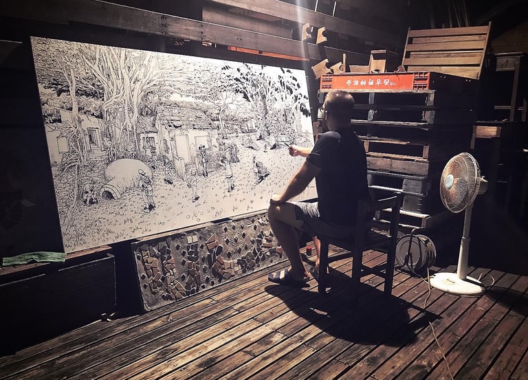 Artist Gene Bond drawing large-scale mural with acrylic marker on outdoor board in Taiwan.