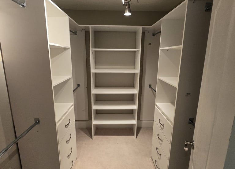 walk-in closet with varies shelfing and drawers