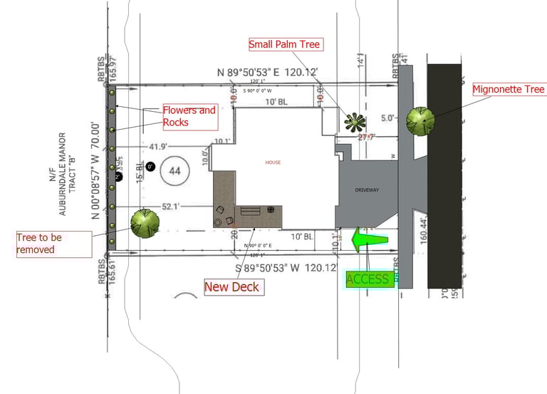 Site plan for residential landscaping showing a new deck, driveway, and tree removal locations.