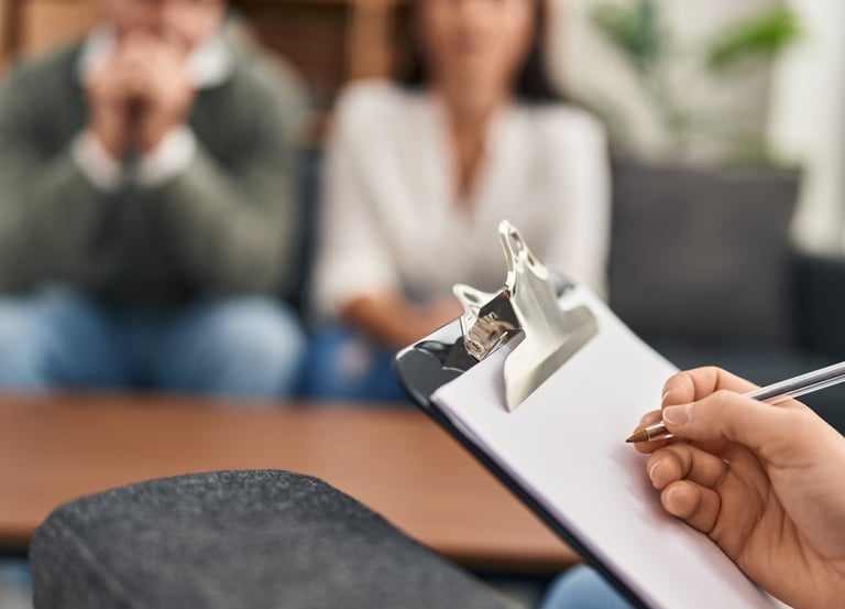 a woman is holding a clipboard and a pen