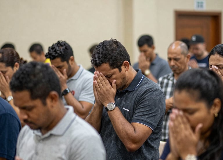 Congregation worshiping together in a warmly lit church interior during a Sunday service.