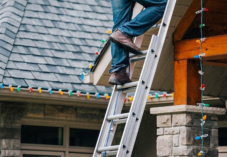Professional roofline Christmas light installation on a Michigan home