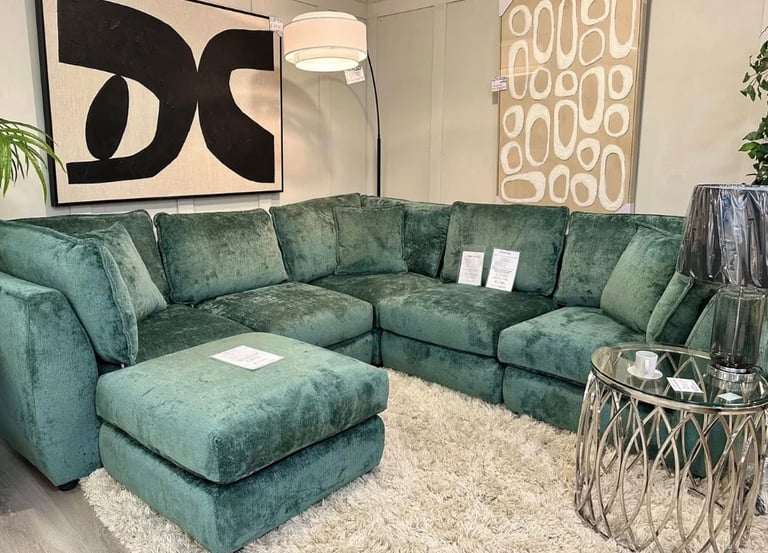 a couch with a green couch and a white rug