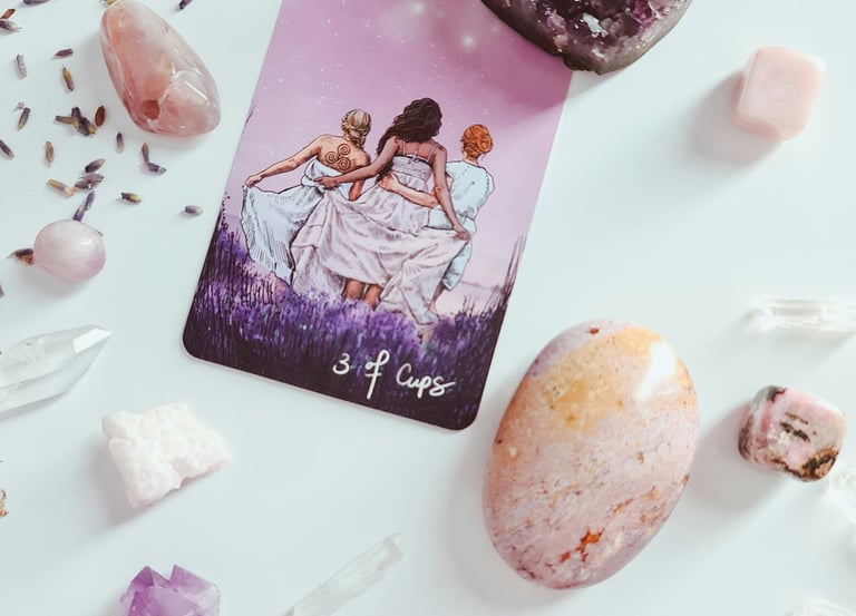 Tarot card, crystals and lavendar. Photo by Edz Norton on Unsplash