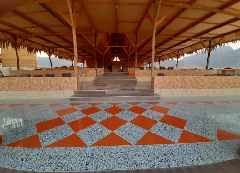 Sinai Life Camp restaurant with ceramic floors, high ceilings, and Bedouin cushion seating on the Nuweiba beach.
