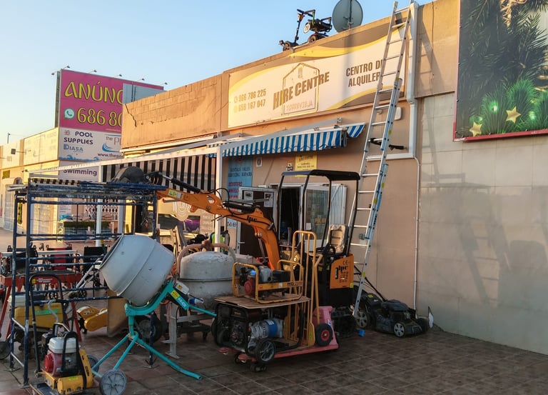 A tool hire shop in Torrevieja with cement mixers, mini excavators, and construction equipment.