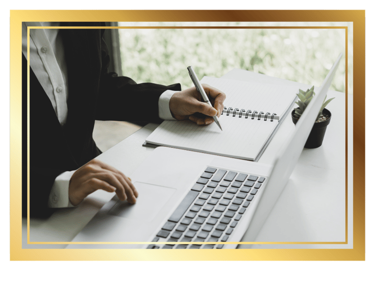 working professional writing in a notebook