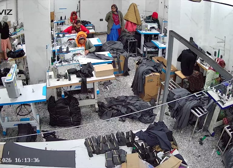 a group of people standing around a table with luggage