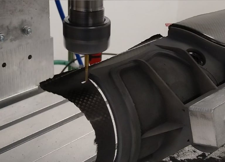 a cnc machine cutting carbon fibre