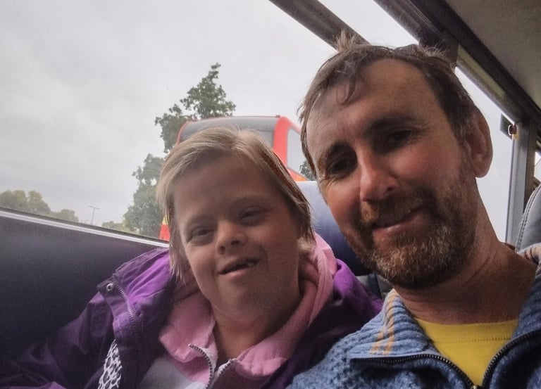 Image of Peter with smiling girl