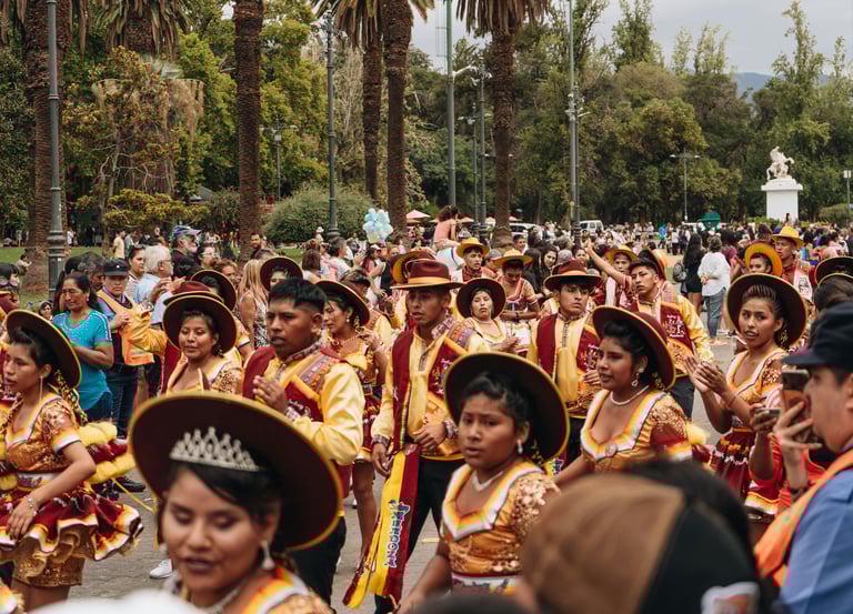 Participants in a Carnaval parade wearing traditional clothing and showing unique cultural customs