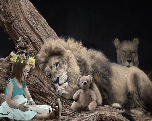 girl reading by lion