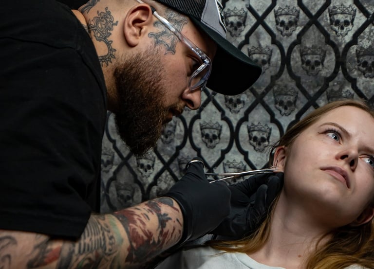 Allen doing an ear piercing