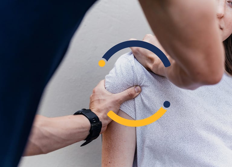 A physical therapist performing a shoulder mobilization adjustment on a female patient's joint.