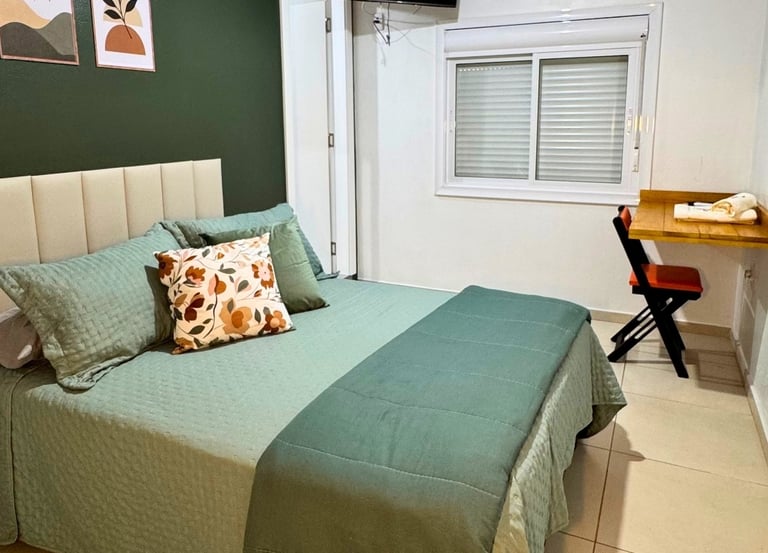 Cama do apartamento executivo do Hotel Presidente em Ibirubá RS