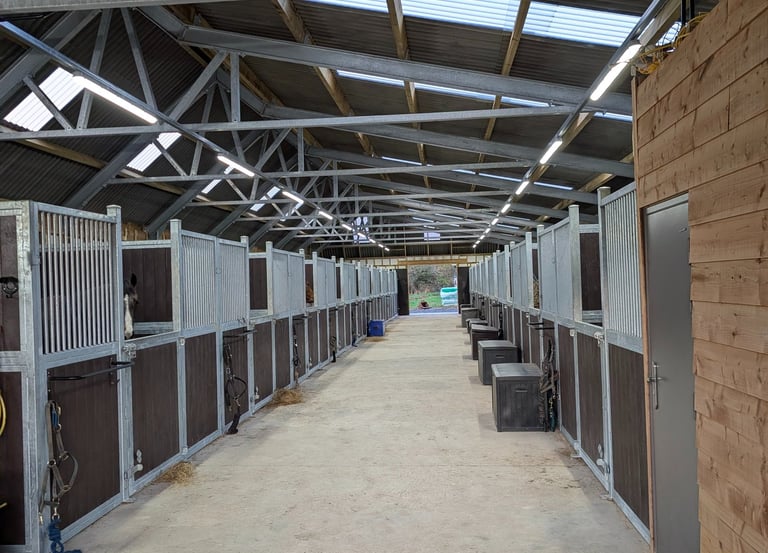 A modern equestrian stable and newly installed efficient Led lighting future proofed with trunking