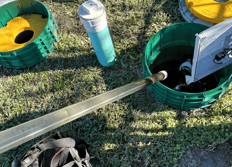 a home septic system being inspected and serviced