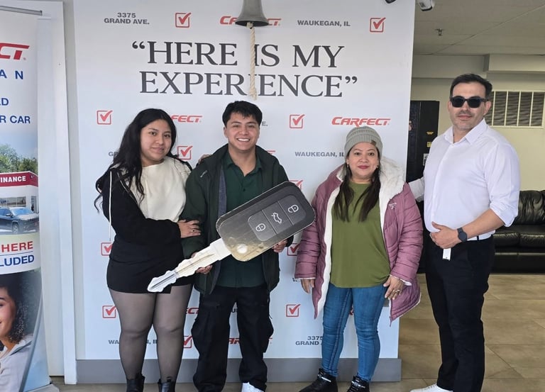 a group of people standing in front of a sign