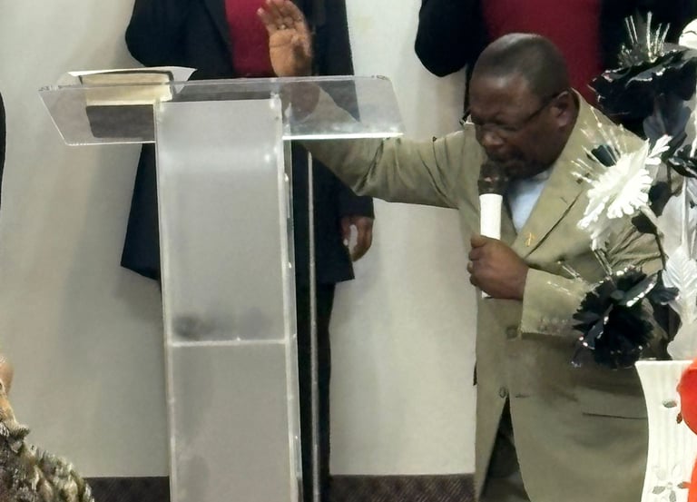 This is our senior pastor Pastor Camille bowing in reverence to God amist our Sunday worship service
